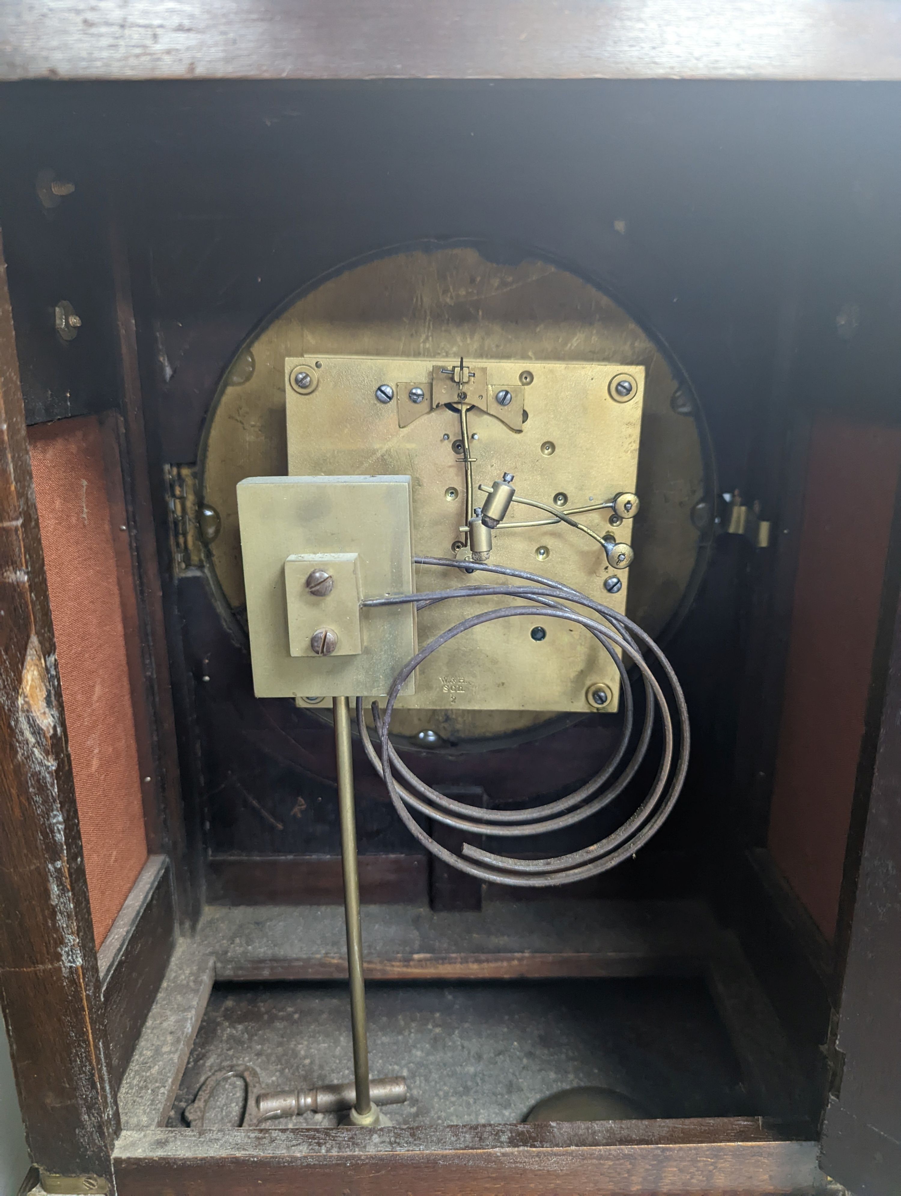 A late 19th century German mahogany and brass mounted mantel clock, 50cm high